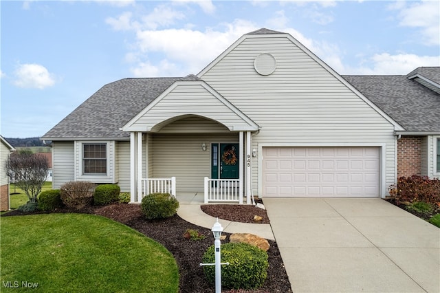 view of front of house with covered porch and a front yard