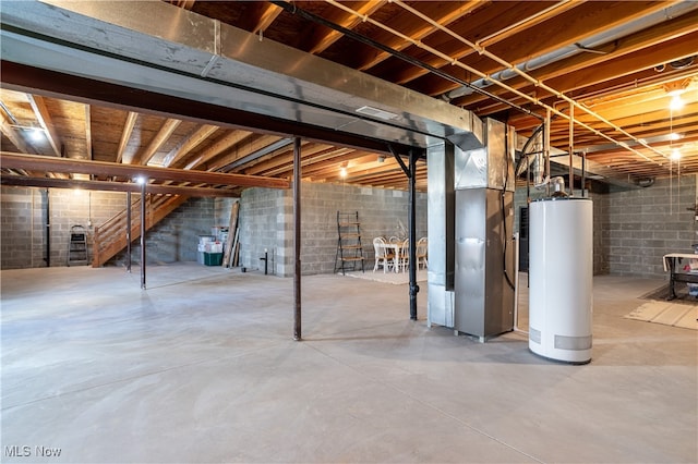 basement featuring gas water heater and heating unit