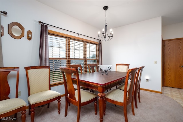 dining space featuring a notable chandelier