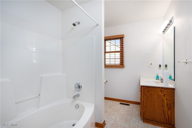 bathroom featuring tile patterned floors, shower / washtub combination, and vanity