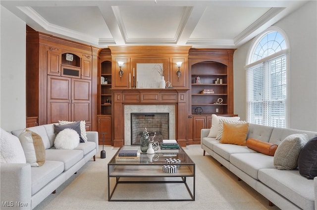 living room with built in shelves, ornamental molding, a premium fireplace, and light carpet