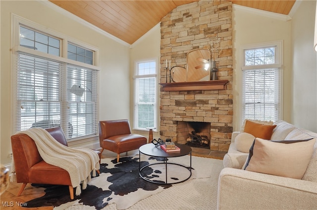 living room with high vaulted ceiling, a stone fireplace, ornamental molding, and wooden ceiling