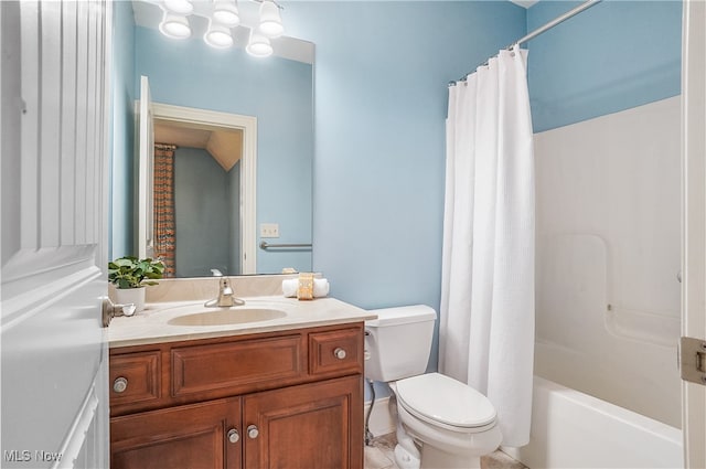 full bathroom with shower / tub combo with curtain, vanity, and toilet