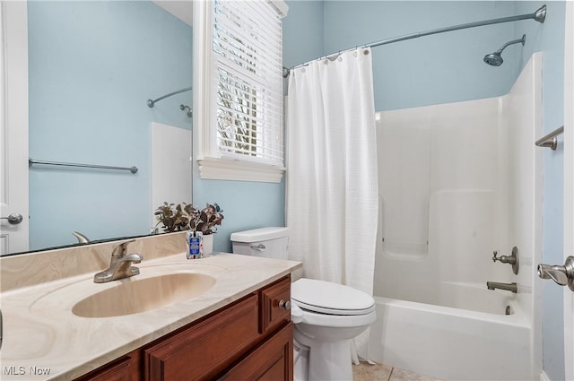 full bathroom featuring tile patterned flooring, vanity, shower / tub combo, and toilet