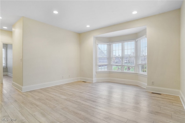 unfurnished room featuring light hardwood / wood-style flooring