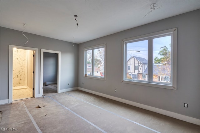 unfurnished bedroom with ensuite bath