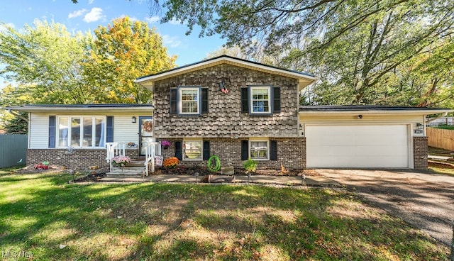 tri-level home with a garage and a front lawn