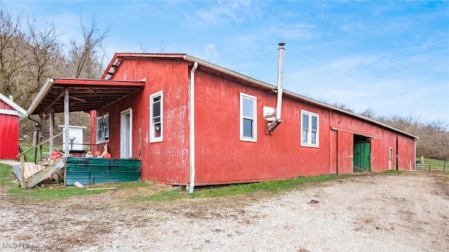 view of home's exterior with an outdoor structure