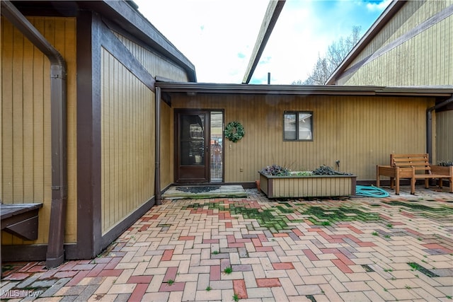 doorway to property featuring a patio area