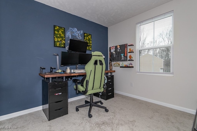 office area featuring carpet floors and a textured ceiling