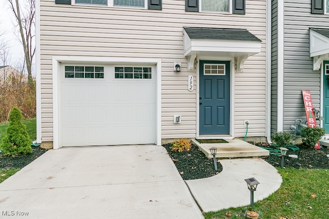 entrance to property featuring a garage