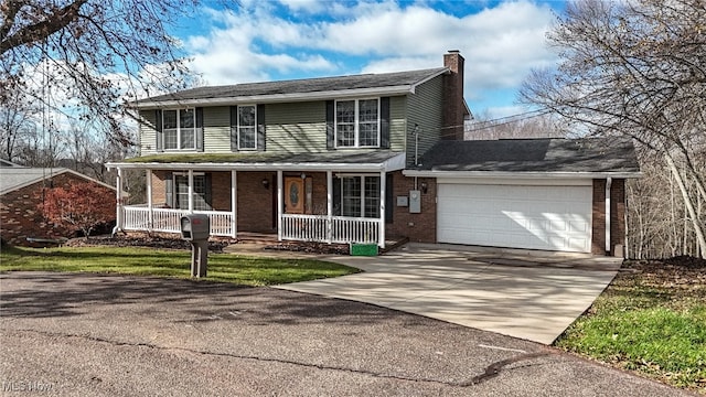 front of property with covered porch and a garage