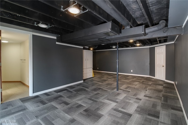 basement with dark colored carpet