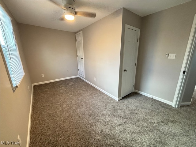 unfurnished bedroom with carpet flooring and ceiling fan