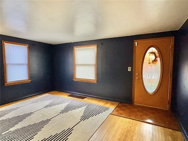 foyer entrance with light hardwood / wood-style floors