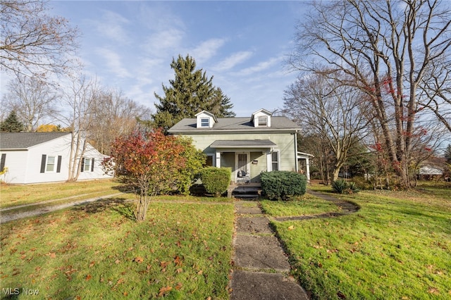 view of front of home with covered porch and a front lawn