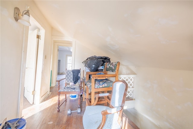 sitting room featuring hardwood / wood-style floors and vaulted ceiling