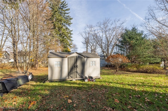 view of outdoor structure with a yard