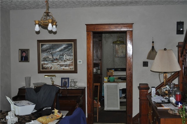 dining area with a textured ceiling