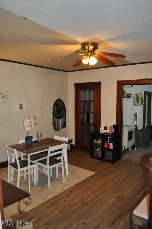 dining room with ceiling fan, wood-type flooring, and heating unit