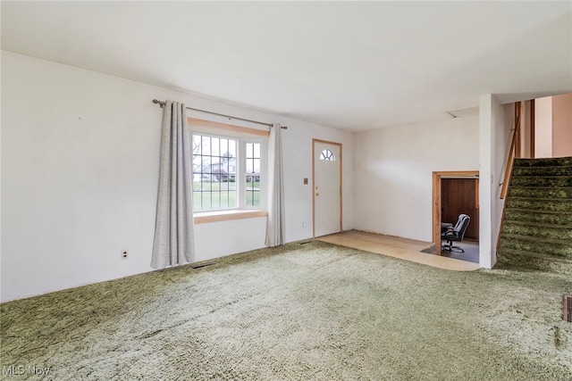 unfurnished living room with carpet floors