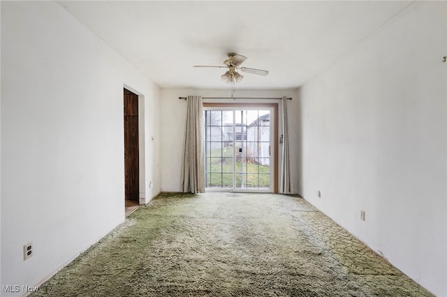 spare room with carpet and ceiling fan