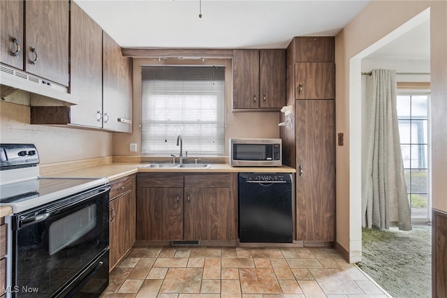 kitchen with sink and black appliances