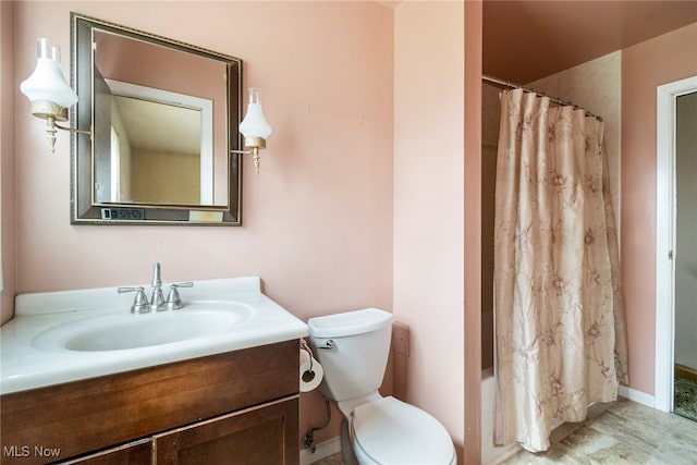 full bathroom featuring vanity, toilet, and shower / tub combo with curtain