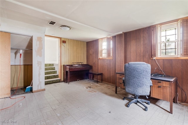 office area featuring wood walls