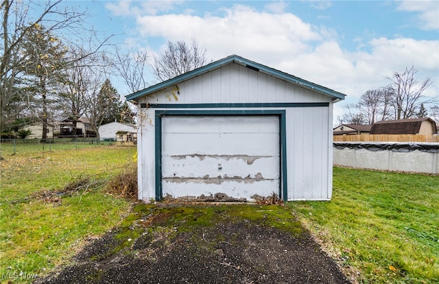 garage with a lawn