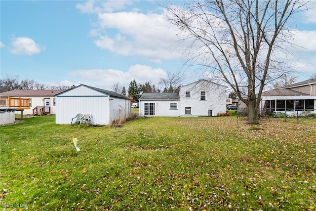 back of house with a lawn