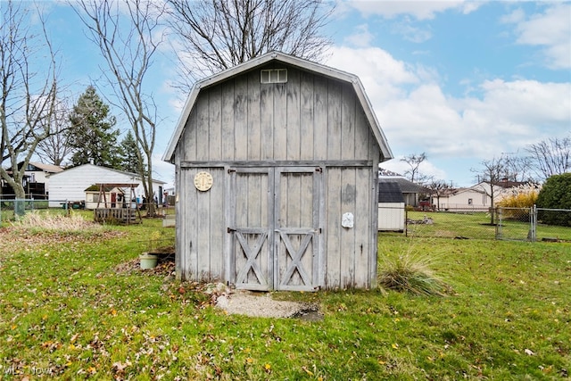 view of outbuilding with a yard