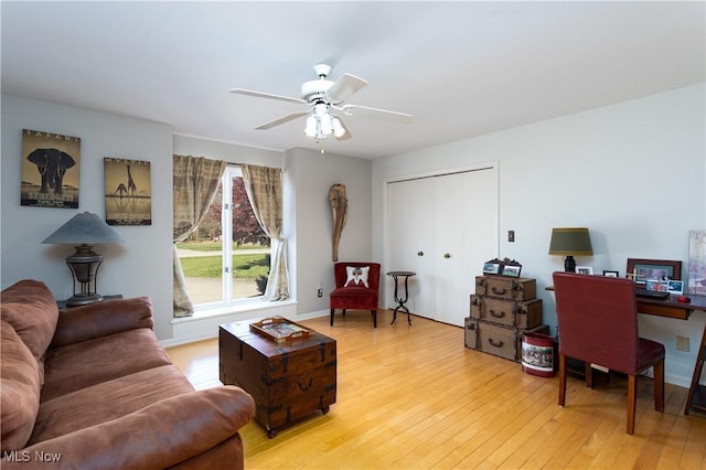 office space featuring ceiling fan and light hardwood / wood-style flooring