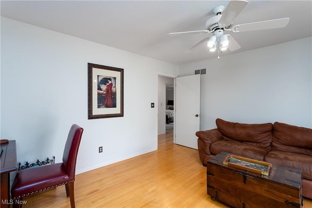 interior space with ceiling fan and light hardwood / wood-style floors