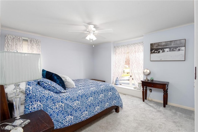 bedroom with carpet floors, ceiling fan, and ornamental molding