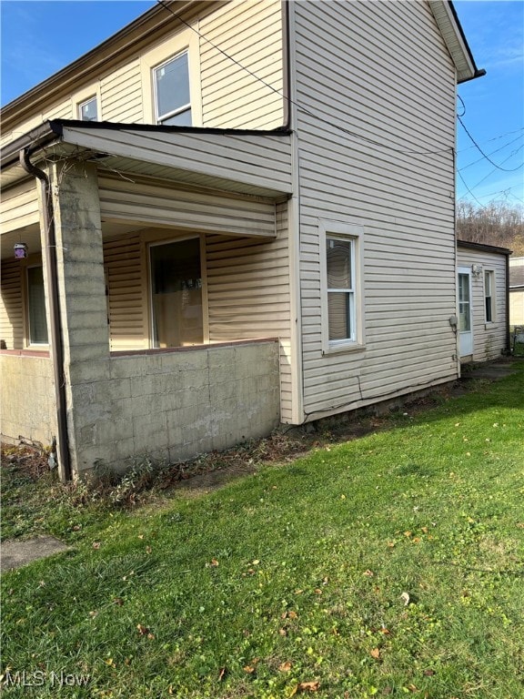 view of property exterior featuring a yard