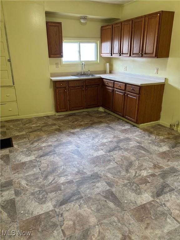 1013 Saint George, East Liverpool, OH 43920 - kitchen with light countertops and brown cabinetry