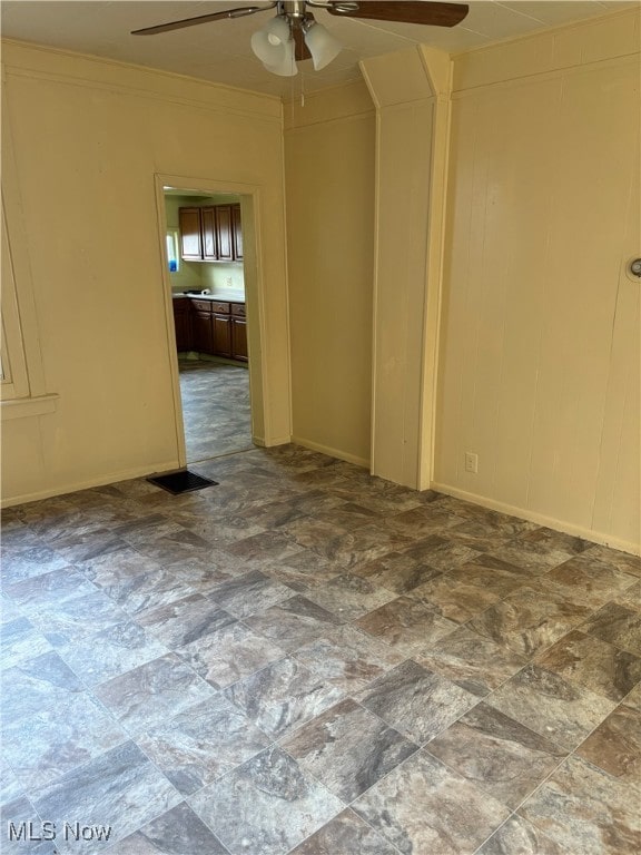 unfurnished room featuring ceiling fan