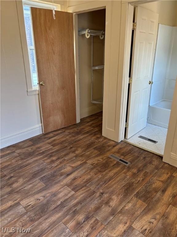 1013 Saint George, East Liverpool, OH 43920 - unfurnished bedroom with dark wood-style flooring and a closet