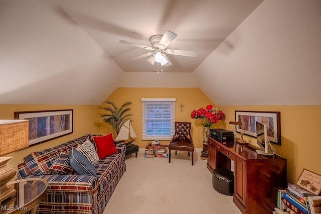 interior space with lofted ceiling, ceiling fan, and carpet flooring