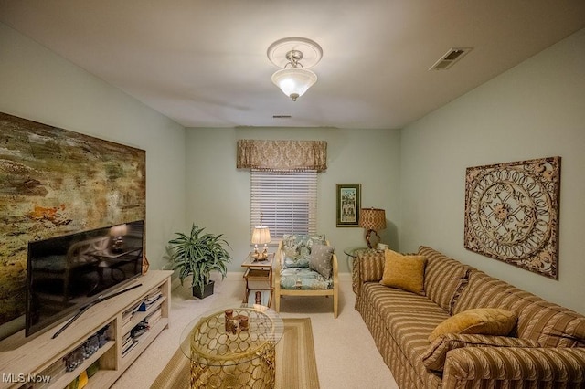 carpeted living area featuring visible vents