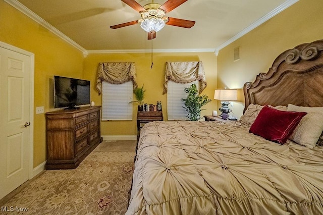 carpeted bedroom featuring visible vents, crown molding, and baseboards