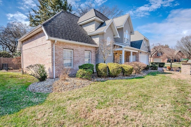 view of home's exterior with a yard and brick siding