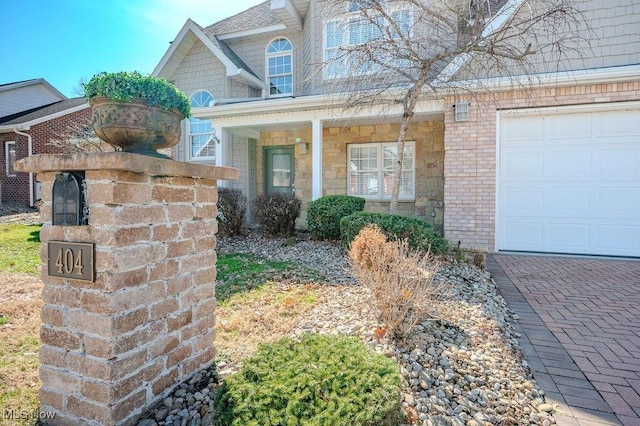 entrance to property featuring brick siding