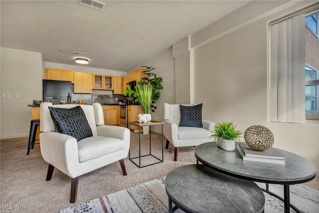 living room featuring light colored carpet