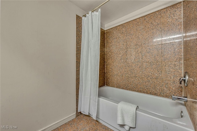 bathroom featuring shower / bath combo with shower curtain