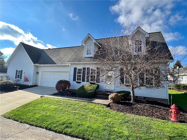 new england style home with a front yard and a garage