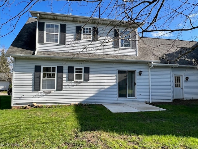 rear view of property with a patio area and a yard