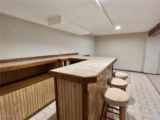 bar featuring tile counters