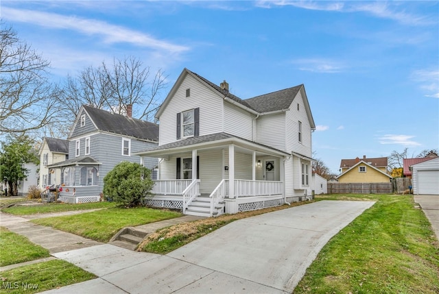 farmhouse featuring a porch and a front yard